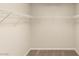 Empty walk-in closet featuring neutral carpet and wire shelf for easy organization at 6014 Belvedere Canyon Ave, Las Vegas, NV 89139