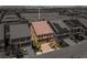 Aerial view of a stucco home in a neighborhood with well-maintained landscaping and desert scenery at 6014 Belvedere Canyon Ave, Las Vegas, NV 89139