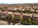 Aerial view of a neighborhood featuring homes with well-maintained yards and desert landscaping at 6014 Belvedere Canyon Ave, Las Vegas, NV 89139