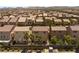 Aerial view of a neighborhood featuring homes with well-maintained yards and desert landscaping at 6014 Belvedere Canyon Ave, Las Vegas, NV 89139