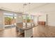 Modern kitchen featuring an island, tile floor, and neutral colors at 6014 Belvedere Canyon Ave, Las Vegas, NV 89139