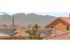 A roof with solar panels with a view of the mountain and neighborhood at 6014 Belvedere Canyon Ave, Las Vegas, NV 89139