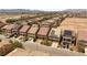 Aerial view of a neighborhood, showcasing homes, driveways, drought resistant landscaping, and street parking at 6014 Belvedere Canyon Ave, Las Vegas, NV 89139