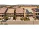 A street view showing a home with drought resistant landscaping, a two car garage and tile roof at 6014 Belvedere Canyon Ave, Las Vegas, NV 89139