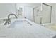Bathroom featuring a modern vanity with double sinks and a glass-enclosed shower at 6063 Peach Orchard Rd, Las Vegas, NV 89142