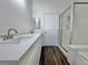 Bathroom boasting a modern vanity with double sinks and a glass-enclosed shower at 6063 Peach Orchard Rd, Las Vegas, NV 89142