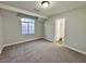 Cozy bedroom with carpet, access to bathroom, a window, and neutral paint at 6063 Peach Orchard Rd, Las Vegas, NV 89142