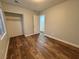 Bedroom with wood floors, closet and a window for natural light at 6063 Peach Orchard Rd, Las Vegas, NV 89142