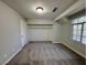 Cozy bedroom with carpet, closet, a window, and neutral paint at 6063 Peach Orchard Rd, Las Vegas, NV 89142