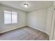 Neutral bedroom featuring carpet floors and window for natural light at 6063 Peach Orchard Rd, Las Vegas, NV 89142