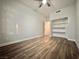 Bedroom featuring wood floors, ceiling fan and closet for storage at 6063 Peach Orchard Rd, Las Vegas, NV 89142