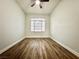 Bright bedroom with wood floors and a window offering natural light at 6063 Peach Orchard Rd, Las Vegas, NV 89142