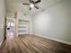 Bedroom featuring wood floors, ceiling fan and closet for storage at 6063 Peach Orchard Rd, Las Vegas, NV 89142