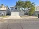 Charming two-story home with a well-maintained front yard and a two-car garage at 6063 Peach Orchard Rd, Las Vegas, NV 89142