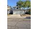 Charming two-story home with a well-maintained front yard and a two-car garage at 6063 Peach Orchard Rd, Las Vegas, NV 89142
