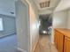 Upstairs hallway featuring carpet flooring, access to another room, and neutral paint at 6063 Peach Orchard Rd, Las Vegas, NV 89142