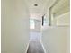 Clean hallway with neutral walls and carpet at 6063 Peach Orchard Rd, Las Vegas, NV 89142