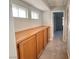 Hallway with built-in storage cabinets and carpet flooring at 6063 Peach Orchard Rd, Las Vegas, NV 89142