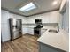 Bright kitchen featuring stainless appliances, modern cabinetry, and light countertops at 6063 Peach Orchard Rd, Las Vegas, NV 89142