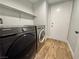 Laundry area features side-by-side washer and dryer at 6063 Peach Orchard Rd, Las Vegas, NV 89142