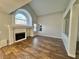 Living area showcasing modern architectural details, a fireplace, and expansive windows at 6063 Peach Orchard Rd, Las Vegas, NV 89142