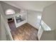 Open living room with wood flooring and abundant natural light at 6063 Peach Orchard Rd, Las Vegas, NV 89142
