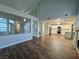Open-concept living space showcasing high ceilings and updated flooring at 6063 Peach Orchard Rd, Las Vegas, NV 89142