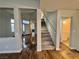 Living room showcasing a staircase to the second floor at 6063 Peach Orchard Rd, Las Vegas, NV 89142