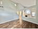 Bright living room showcasing vaulted ceilings, wood-look flooring, and an open floorplan with fireplace at 6063 Peach Orchard Rd, Las Vegas, NV 89142