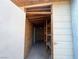 Inside of the storage shed, it has shelving for storage and a secure grated window at 6063 Peach Orchard Rd, Las Vegas, NV 89142