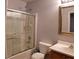 Bathroom with shower-tub combo, mirror, and sink and toilet at 6283 Lapilli Ave, Las Vegas, NV 89139