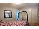 Bedroom with queen bed, closet, and attached bathroom at 6283 Lapilli Ave, Las Vegas, NV 89139