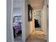 A hallway leads to the bedroom with hardwood floors and neutral wall paint at 6283 Lapilli Ave, Las Vegas, NV 89139