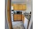 Well-equipped kitchen with wood cabinetry, tile flooring, and efficient layout at 6283 Lapilli Ave, Las Vegas, NV 89139