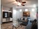 Bright living space with a modern entertainment center and cozy seating arrangement at 6283 Lapilli Ave, Las Vegas, NV 89139