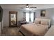 Comfortable main bedroom with light color walls, carpet flooring, and a bay window at 6283 Lapilli Ave, Las Vegas, NV 89139