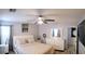 Comfortable main bedroom with light color walls, carpet flooring, and a bay window at 6283 Lapilli Ave, Las Vegas, NV 89139