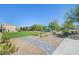 A community park with walking path and landscaping at 6283 Lapilli Ave, Las Vegas, NV 89139
