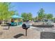 Community barbeque and playground structure next to pool at 6283 Lapilli Ave, Las Vegas, NV 89139