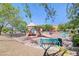 Community playground featuring slides, swings, and benches for relaxation at 6283 Lapilli Ave, Las Vegas, NV 89139