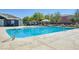 Community pool with lounge chairs and landscaping providing relaxation at 6283 Lapilli Ave, Las Vegas, NV 89139