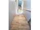 Staircase with wood-look tile steps and white banister at 6283 Lapilli Ave, Las Vegas, NV 89139