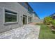 Backyard features a paver patio, turf, and some plants for added privacy at 629 Soaring Wings Ave, Las Vegas, NV 89183