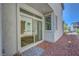 Backyard with sliding glass door and paver patio at 629 Soaring Wings Ave, Las Vegas, NV 89183