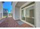 Backyard with sliding glass door access and rock landscaping at 629 Soaring Wings Ave, Las Vegas, NV 89183