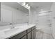 Bathroom featuring a double vanity with white countertop and combination tub and shower at 629 Soaring Wings Ave, Las Vegas, NV 89183