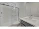 Clean bathroom with a glass-enclosed shower, modern vanity, and neutral decor at 629 Soaring Wings Ave, Las Vegas, NV 89183