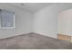 This bedroom has light gray carpet and white walls for a neutral interior at 629 Soaring Wings Ave, Las Vegas, NV 89183
