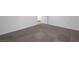 Neutral bedroom with light gray carpet, white baseboards, and simple decor at 629 Soaring Wings Ave, Las Vegas, NV 89183