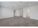Large bonus room featuring carpet flooring and multiple entryways at 629 Soaring Wings Ave, Las Vegas, NV 89183